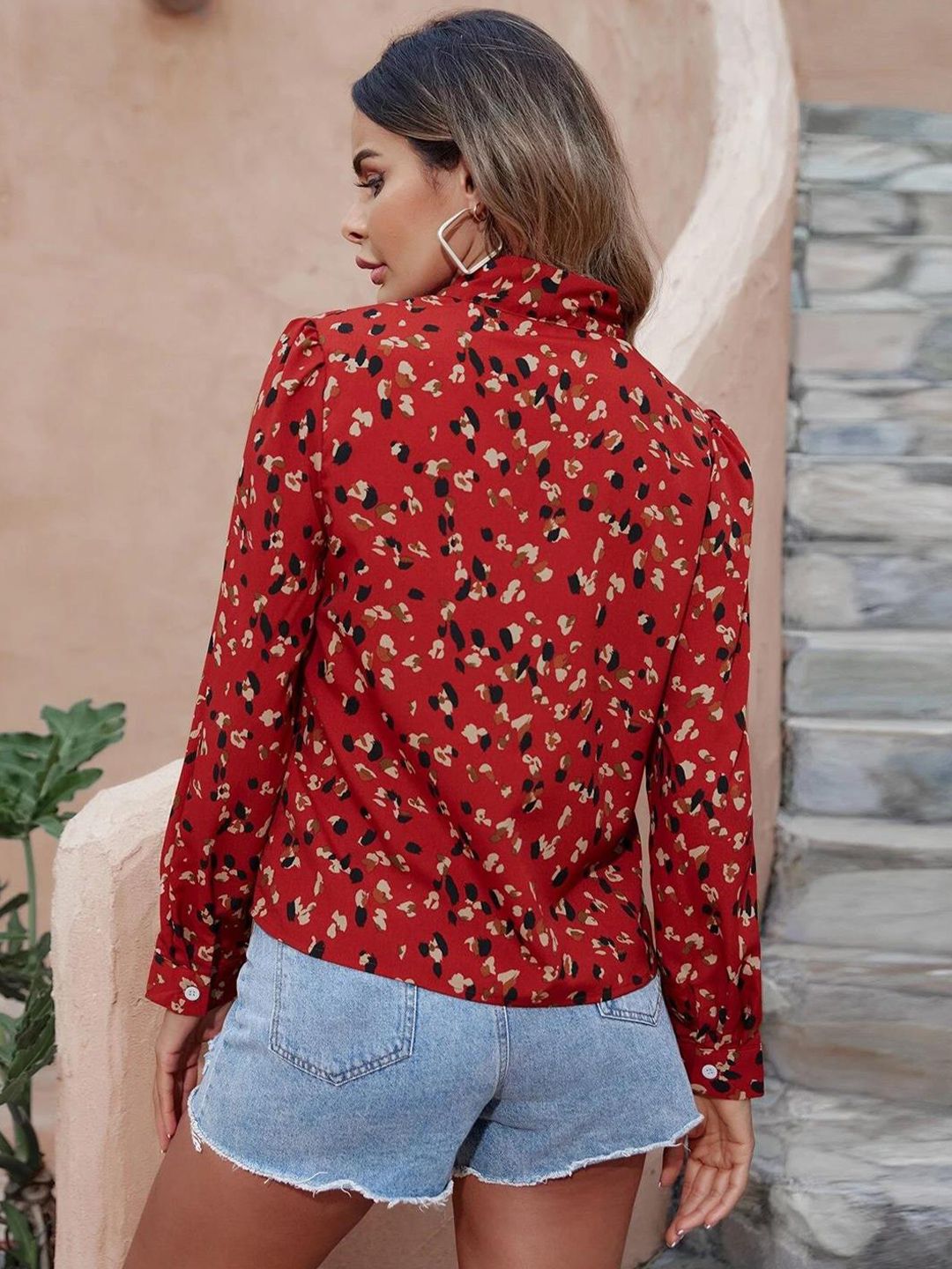 Kotty Red Abstract Printed Tie-Up Neck Regular Top