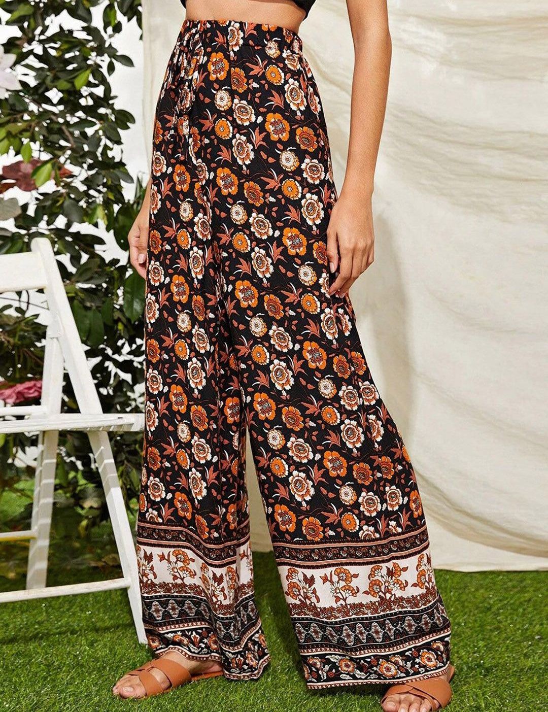 Kotty Women Black Floral Printed Relaxed Flared High-Rise Easy Wash Trousers