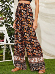 Kotty Women Black Floral Printed Relaxed Flared High-Rise Easy Wash Trousers