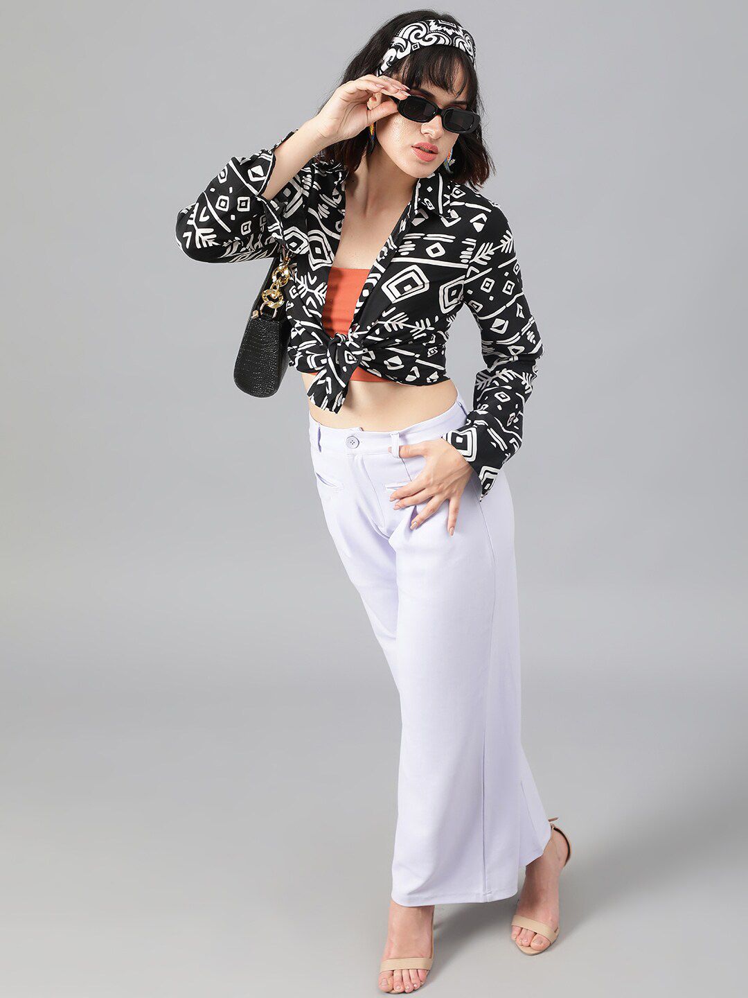 Kotty Women White Relaxed Straight Leg Fit High-Rise Easy Wash Pleated Parallel Trousers