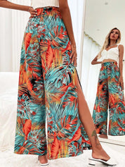 Kotty Women Teal Floral Printed Relaxed Flared High-Rise Easy Wash Pleated Trousers