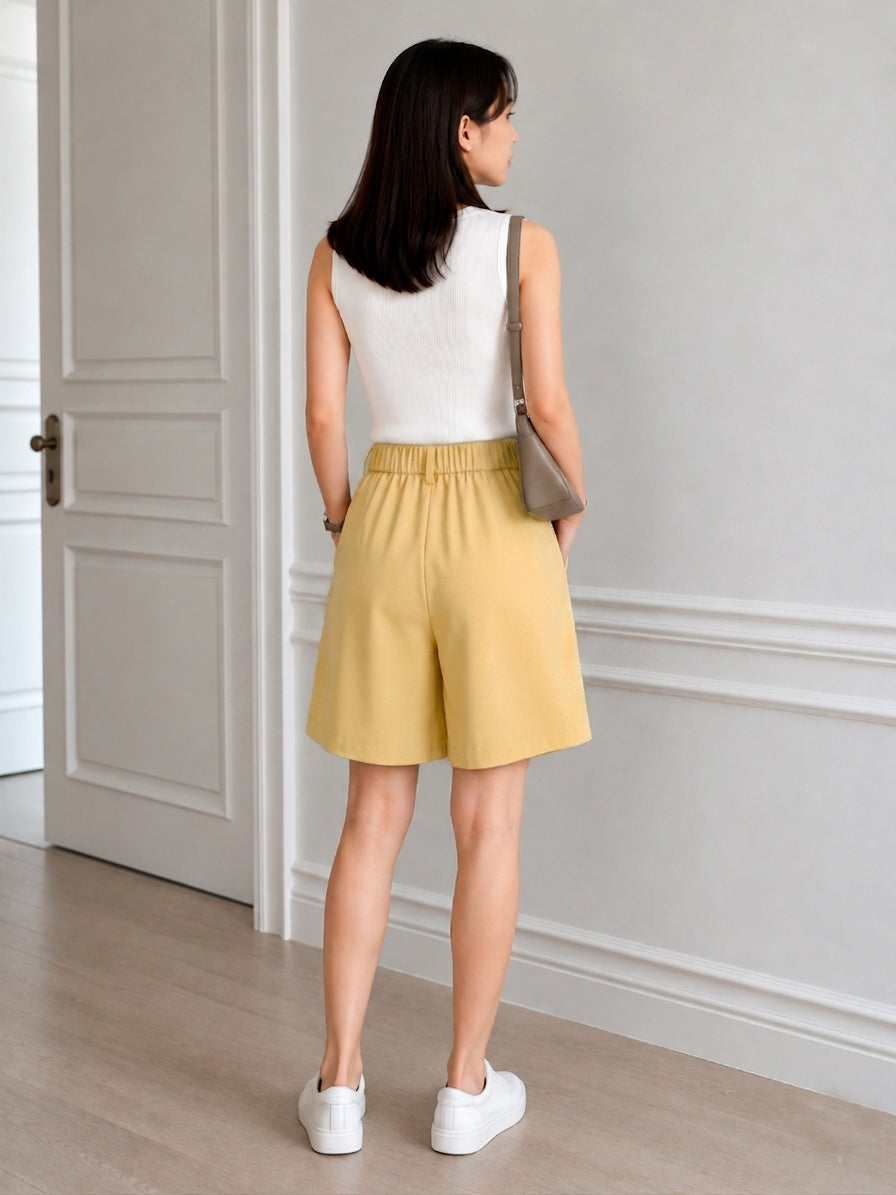 Wide-Leg Tailored Pleated Shorts in Muted Yellow
