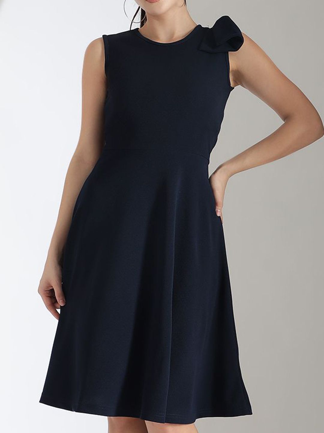 Kotty Solid Round Neck Bow Detailed Fit & Flare Dress