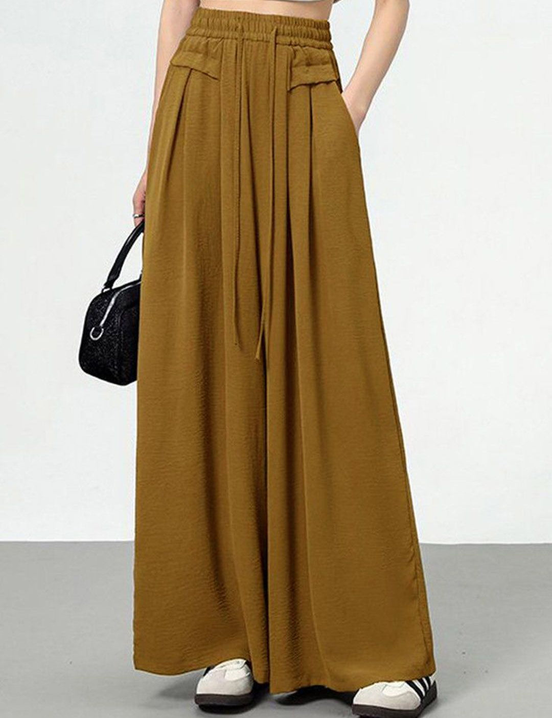 Kotty Women Loose Fit High-Rise Solid Breathable Easy Wash Pleated Crumble Trousers