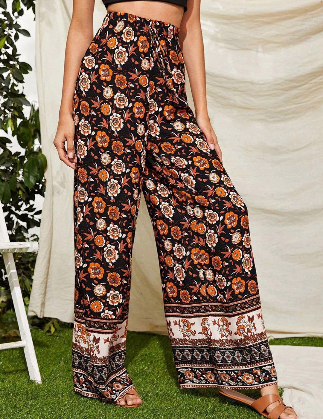 Kotty Women Black Floral Printed Relaxed Flared High-Rise Easy Wash Trousers