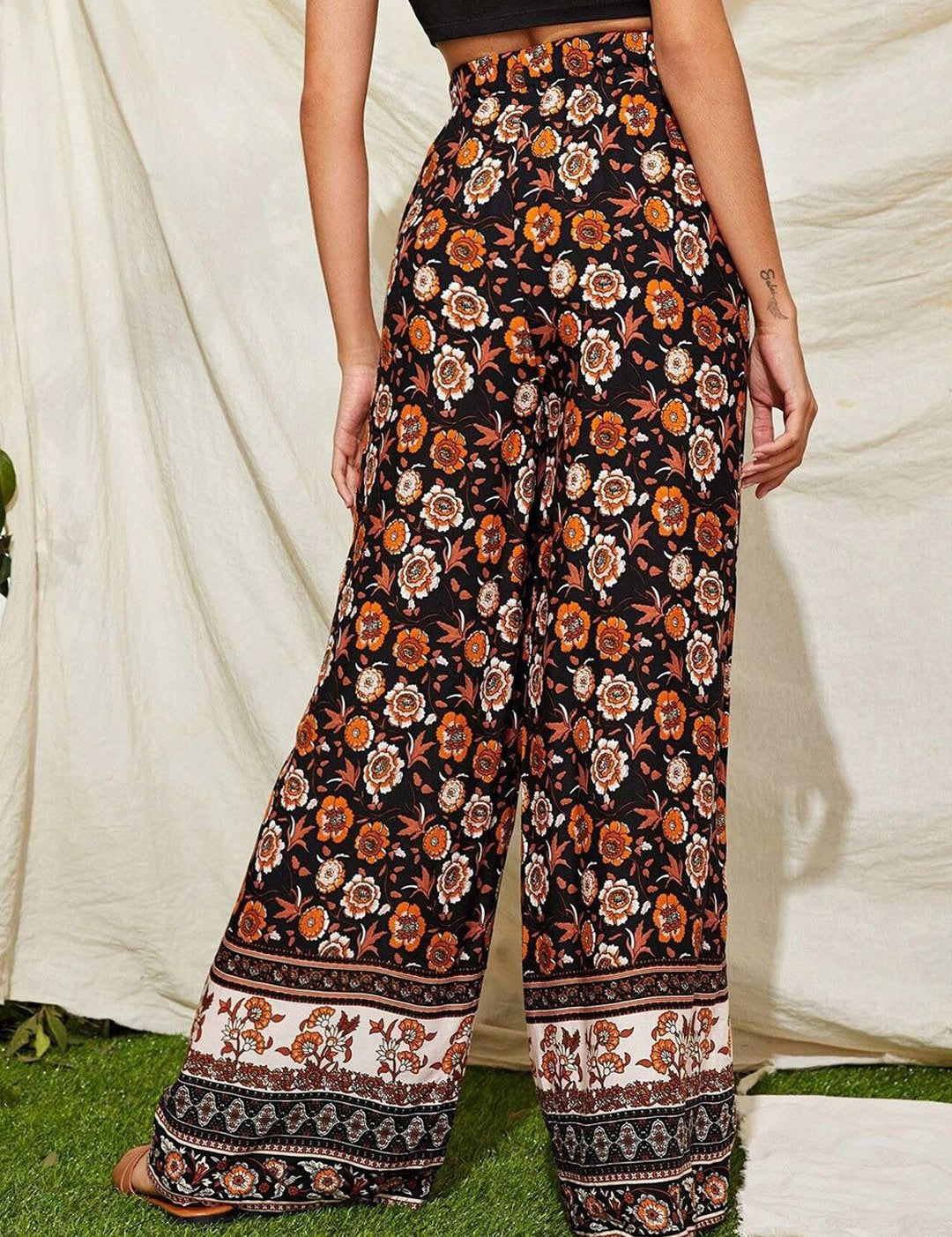 Kotty Women Black Floral Printed Relaxed Flared High-Rise Easy Wash Trousers