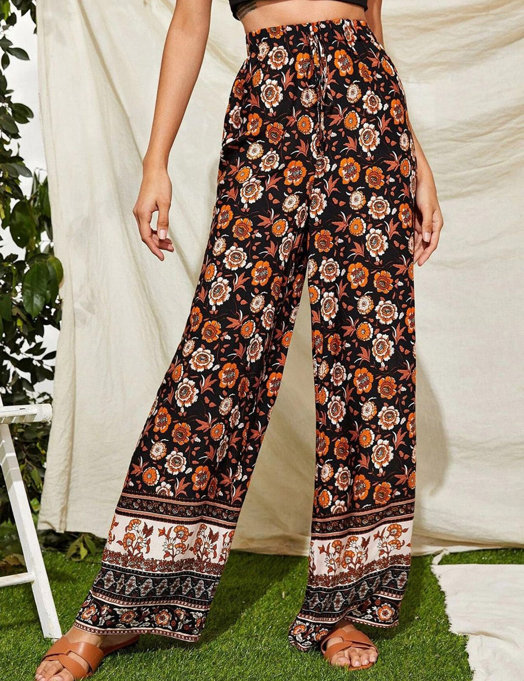 Kotty Women Black Floral Printed Relaxed Flared High-Rise Easy Wash Trousers