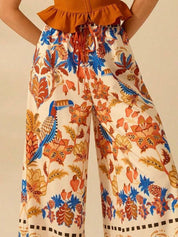 Kotty Women Floral Printed Comfort Flared High-Rise Regular Trousers