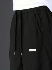 Kotty Men Relaxed High-Rise Corduroy Joggers Trousers