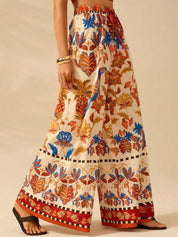 Kotty Women Floral Printed Comfort Flared High-Rise Regular Trousers